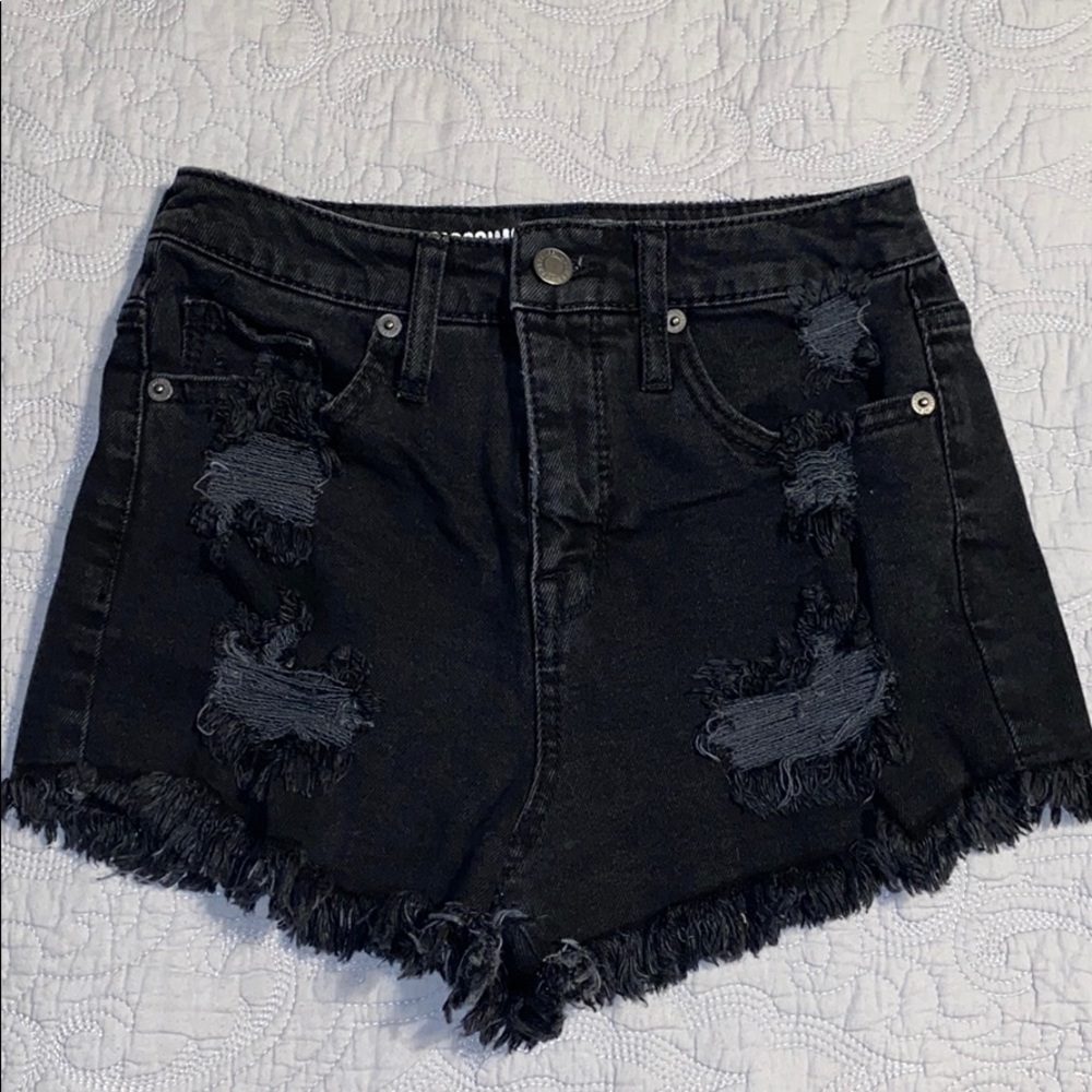 Ripped/Black Shorts.